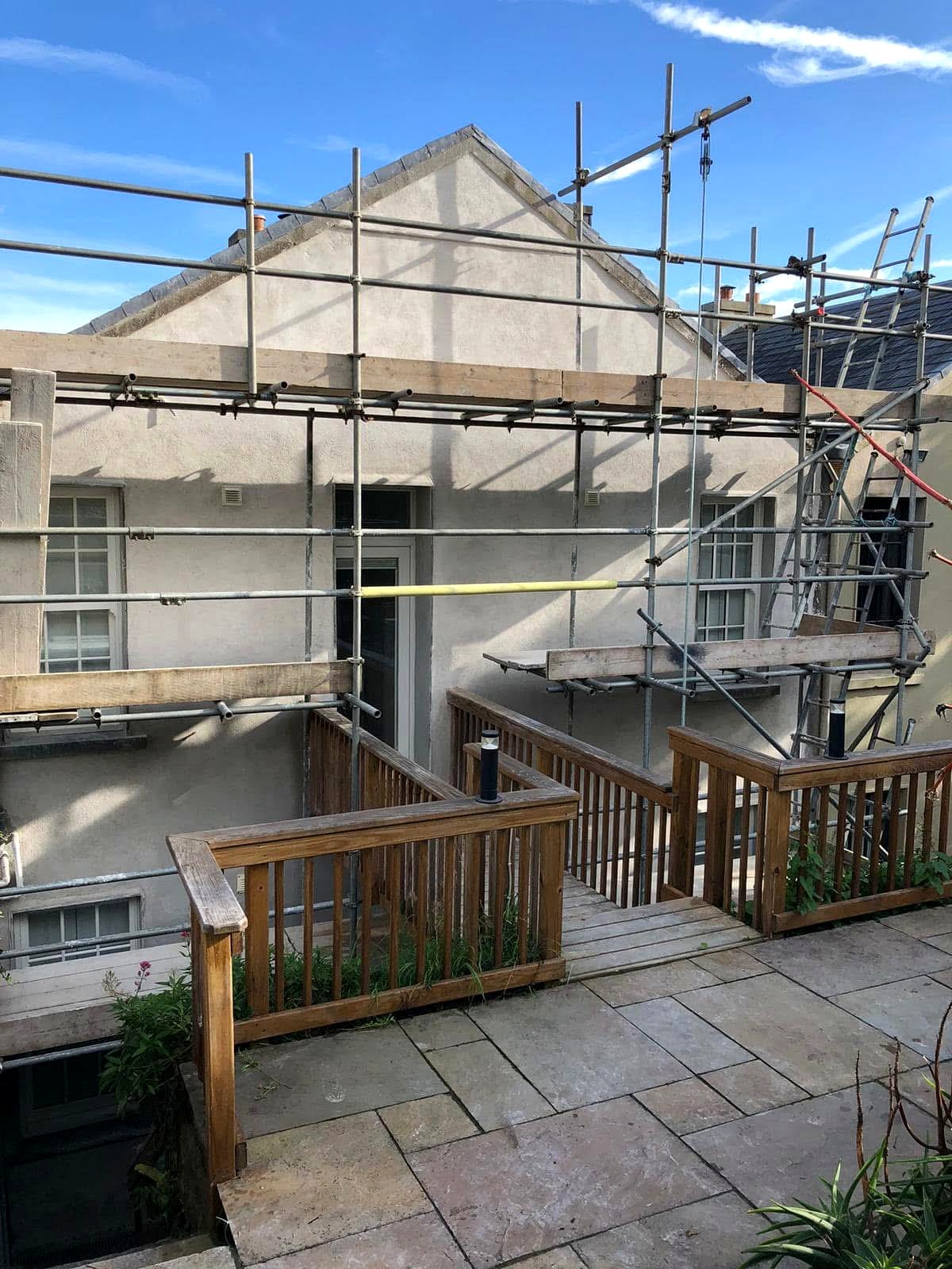 Scaffolded two-storey house during external render works