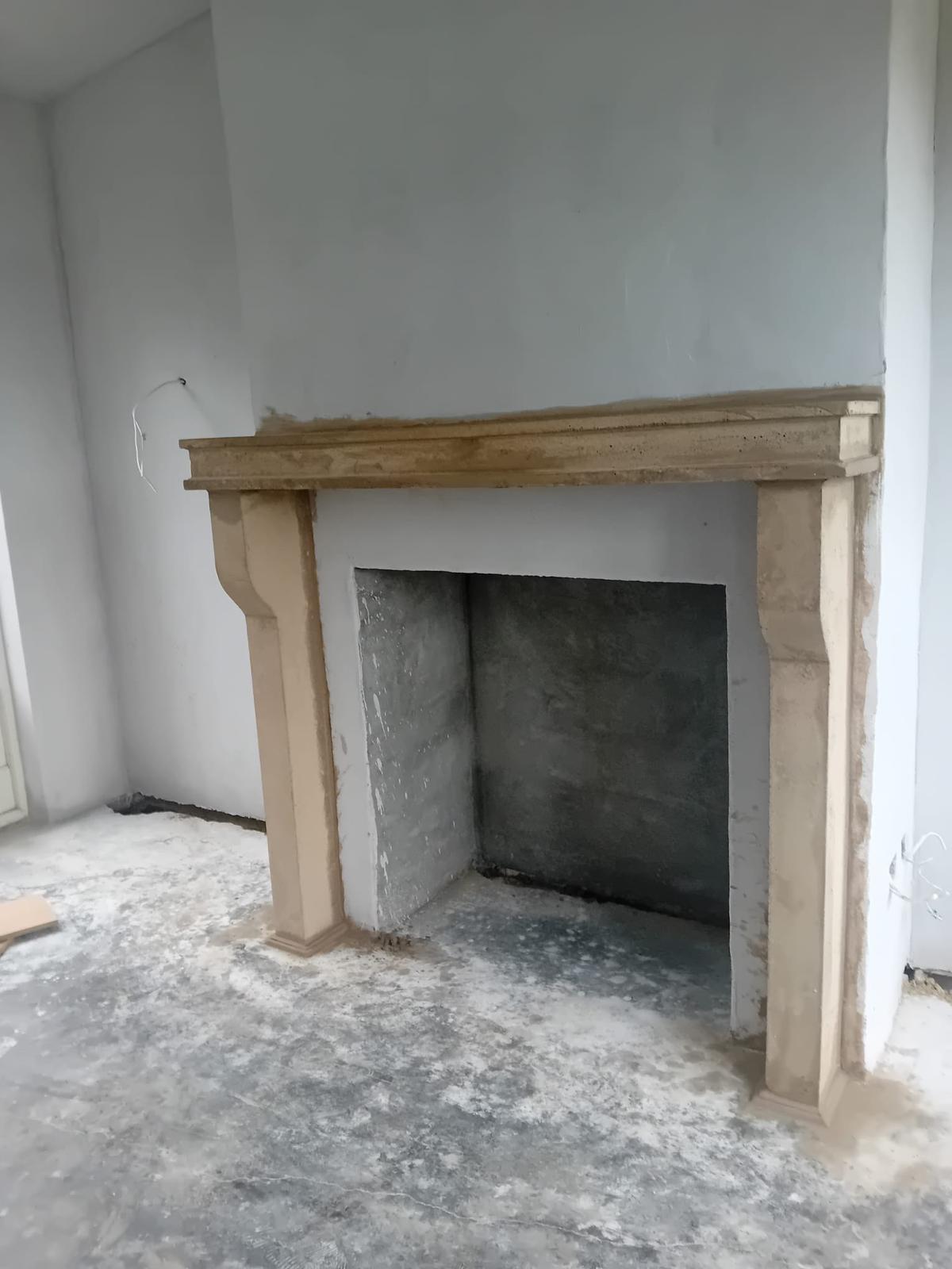 Detail of a completed bespoke fireplace with hand-modelled mantel shelf