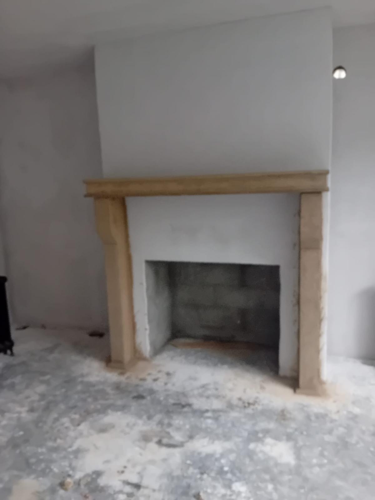 Bespoke fireplace surround installed and ready for finishing